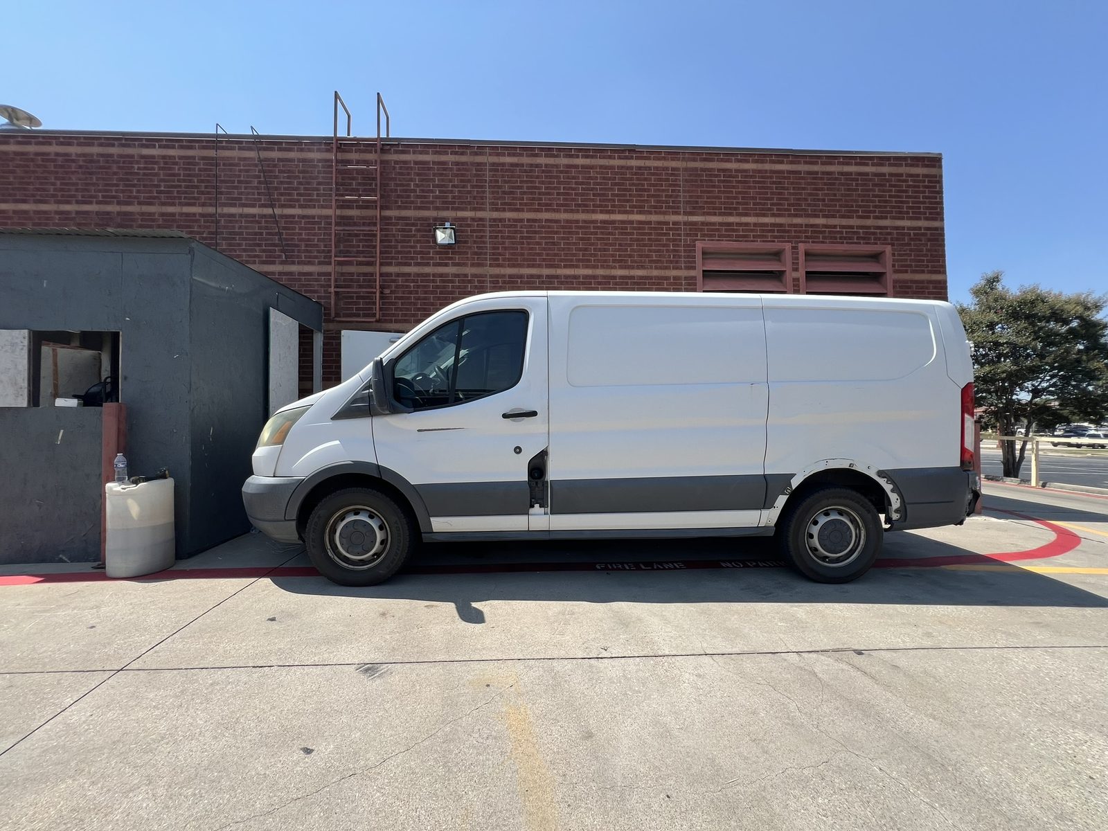 The Dry Clean Super Center delivery van parked outside the Benbrook plant