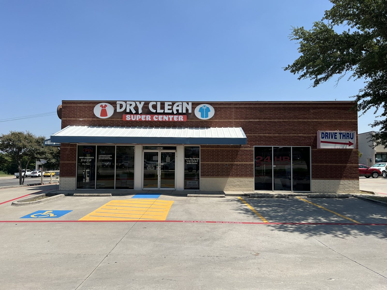 Dry Clean Super Center storefront and parking area in Benbrook
